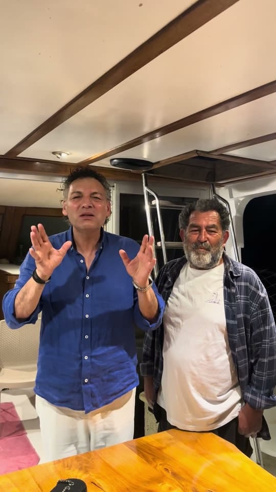 Vahe Kılıçarslan and Captain Osman aboard Poseidon 07 at night